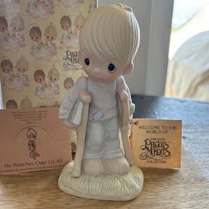 Precious Moments Figurine — “He Watches Over All Of Us”